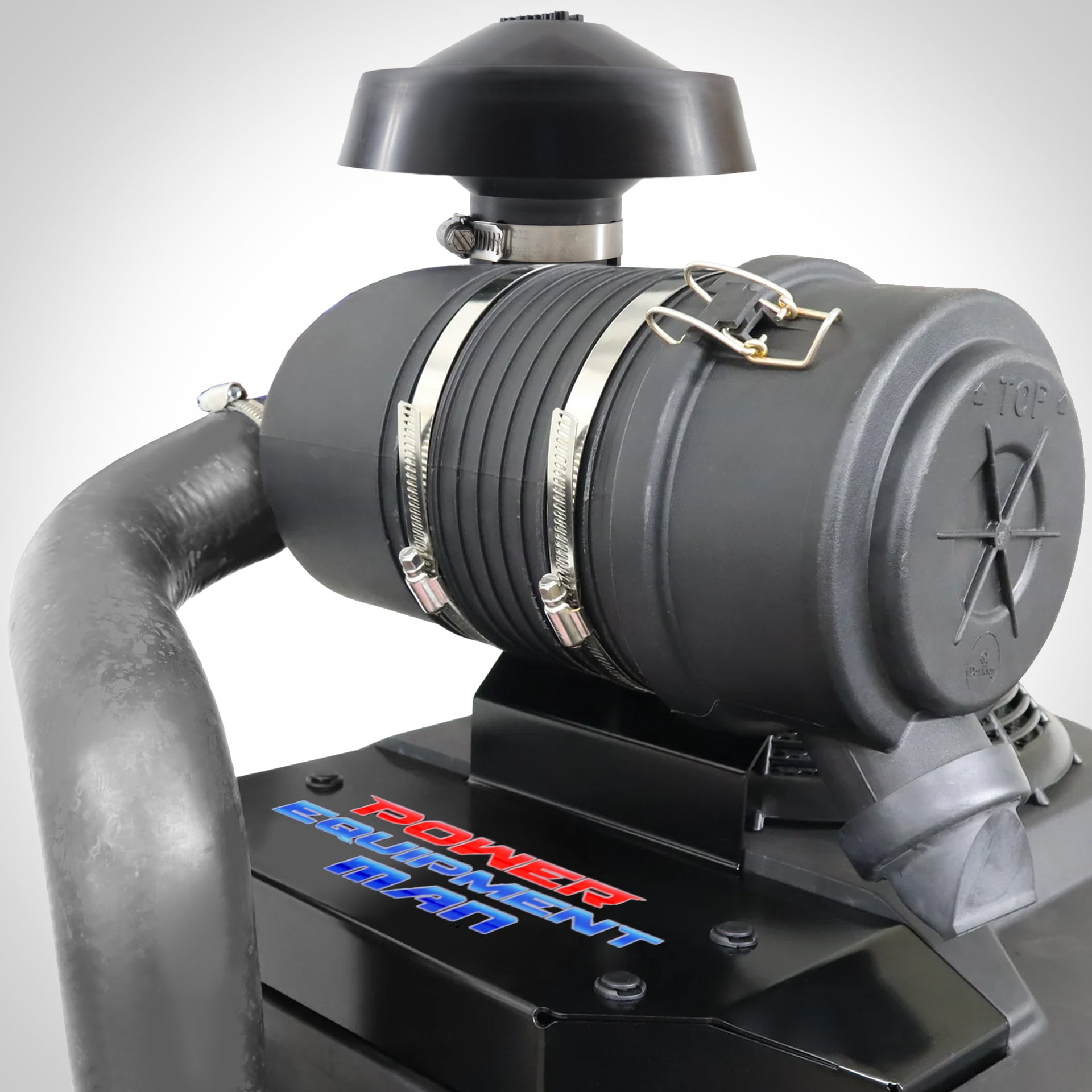 An air filter upgrade kit installed on a Kawasaki FS engine, featuring a black air filter housing and mounting bracket with visible branding.